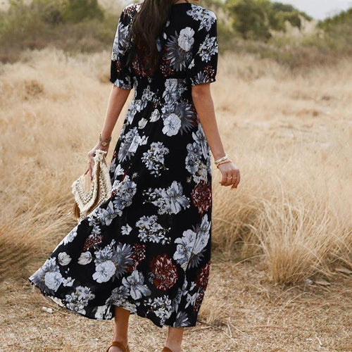 Mandotos floral summer beach dress with V-neck and elastic waist, ideal for women relaxing at the beach or casual outings.