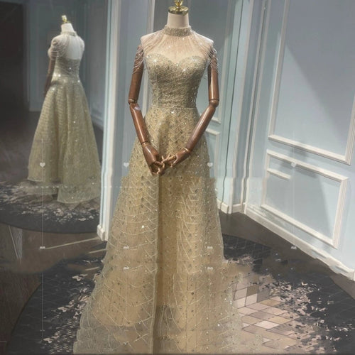 Mandotos golden neck hanging light luxury toast evening dress with elegant design and intricate details.