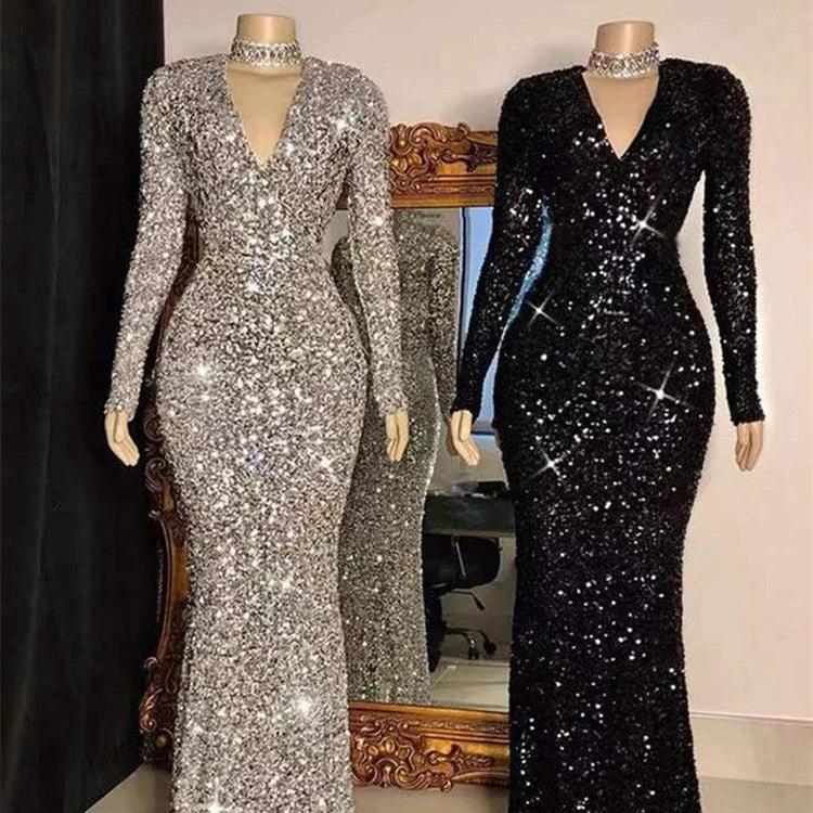 Grey long sleeve sequin evening dress by MANDOTOS, featuring a fitted silhouette and elegant design for formal occasions.