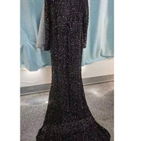 Grey long sleeve sequin evening dress by MANDOTOS, featuring a fitted silhouette and elegant design.