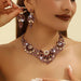 Mandotos crystal necklace and earrings suite featuring high-profile, generous design with sparkling clear crystals.