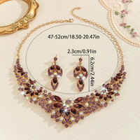 Mandotos crystal necklace and earrings suite featuring high-profile, generous design with sparkling clear crystals for elegant style.