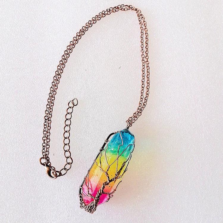 Mandotos stone crystal pillar Tree of Life pendant necklace, stylish jewelry with intricate design and natural crystal details.