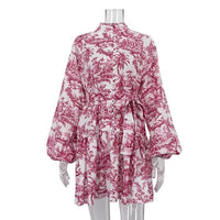 Mandotos ink print long sleeve short dress with puffy sleeves, lapel collar, and A-line silhouette on model.