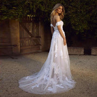 Mandotos off-the-shoulder lace wedding dress with appliques, A-line silhouette, princess style, bridal gown for special occasions.