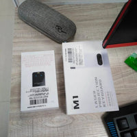 Mandotos LEING FST virtual laser Bluetooth wireless keyboard projecting onto a surface, with integrated mouse function for computer and phone use.
