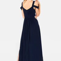 Long floor-length elegant Greek style pleated dress by MANDOTOS, featuring flowing fabric and sophisticated design.