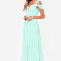 Long floor-length elegant Greek style pleated dress by MANDOTOS, shown in a flowing, sophisticated design with intricate pleats.