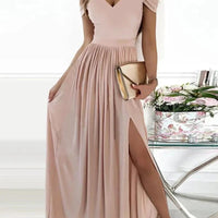 Elegant MANDOTOS Greek style long floor-length pleated dress displayed, showcasing flowing fabric and intricate pleats.