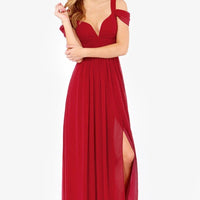 Long floor-length elegant Greek style pleated dress by MANDOTOS, showcasing flowing fabric and intricate pleats.