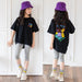 Mandotos cartoon irregular black graphic tee for big kids with colorful bear back print and short sleeves.