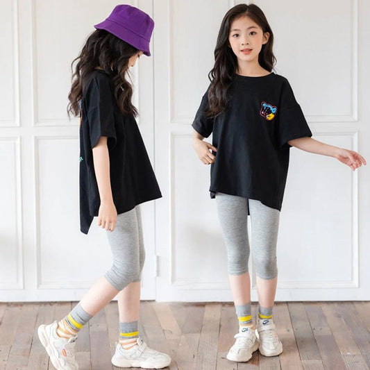 Mandotos cartoon irregular black graphic T-shirt for big kids with colorful bear back print and short sleeves.