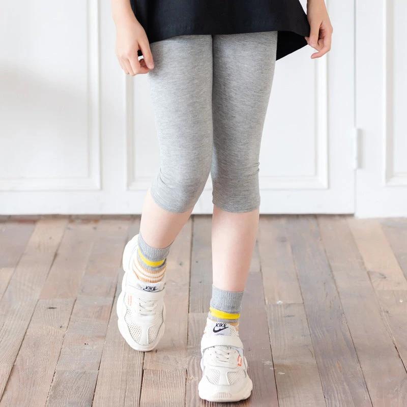 MANDOTOS cartoon irregular black graphic tee for kids with colorful bear back print and short sleeves.