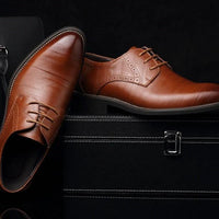 Mandotos men's leather dress shoes and casual large-size shoes, black leather with sleek design for business or casual wear.