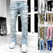 Men's stacked jeans by Mandotos, long tight fit trousers with individual patched design, suitable for bold style and casual wear.