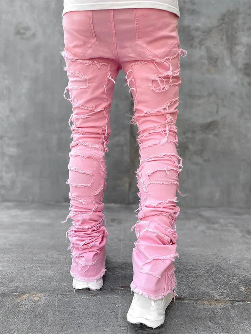 Men's Mandotos stacked jeans with patched design, long tight fit trousers showcasing bold style and detailed denim features.