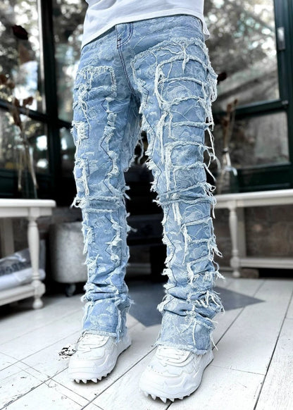 Men's stacked jeans by Mandotos, long tight-fit trousers with patched details, designed for a bold and stylish look.
