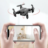 Mini folding drone from MANDOTOS with compact design and propellers, suitable for aerial photography and indoor flying.