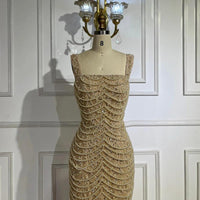 Nude elegant sling dress by MANDOTOS featuring light luxury design with pearl beaded embellishments and high-end style.
