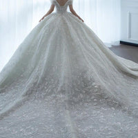 Off shoulder French main wedding dress by MANDOTOS, featuring elegant fabric and classic design perfect for bridal attire.