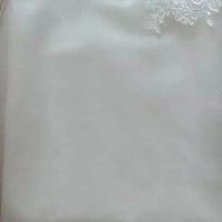 White Princess Bride mermaid wedding dress by MANDOTOS featuring backless lace design with trailing train.