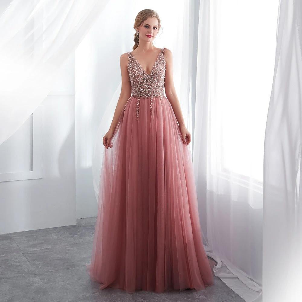 Elegant black prom dress by MANDOTOS featuring a fitted bodice and flowing skirt, perfect for formal evening events.