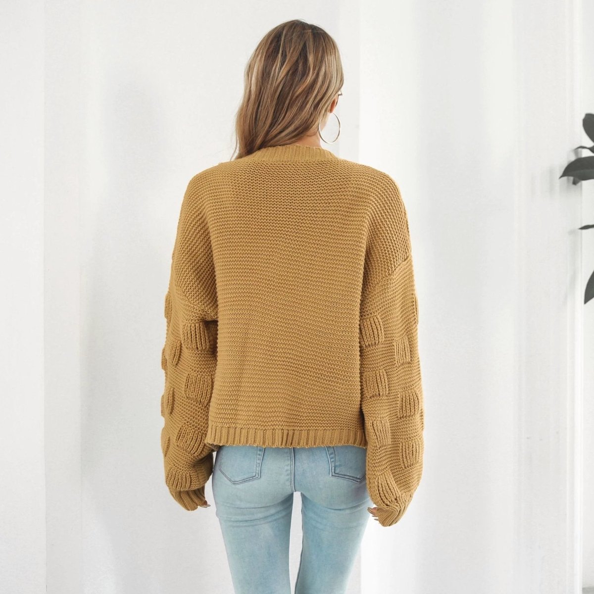 Mandotos women's puff sleeve cardigan sweater with chunky knit texture and front coat style, stylish and cozy knitwear for women.
