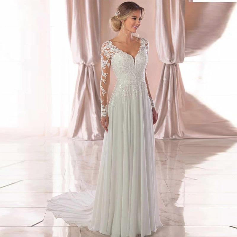 White backless deep V-neck wedding dress for women by MANDOTOS, elegant evening dress with a sexy, flowing silhouette.