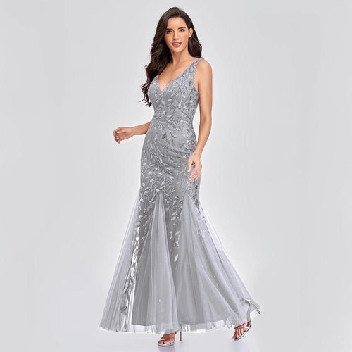 Mandotos sleeveless long mermaid dress with V-neck, embroidered sequins, and a slim fit for an elegant evening look.