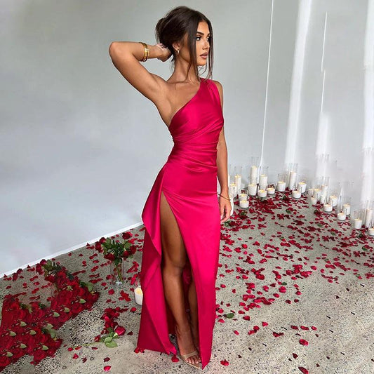 Elegant summer satin dress by MANDOTOS featuring a sexy one-shoulder, backless design with a high slit and slim fit in solid color.