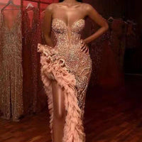 Sexy sequined tube top dress by MANDOTOS featuring a fitted silhouette and shimmering embellishments, perfect for evening wear.