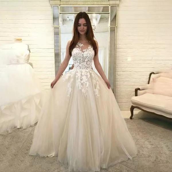 Mandotos sleeveless floral lace wedding dress with intricate flower appliqués, romantic bridal gown perfect for special occasions.