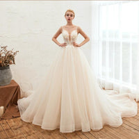 Starry Sky Luxury wedding dress by MANDOTOS featuring a sleek, thin ig tail and a dreamy, beakless design for elegant bridal style.