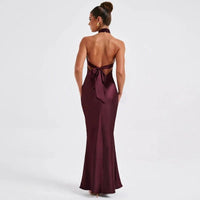 Elegant backless sleeveless summer dress by MANDOTOS, showcasing a flowing fabric and stylish design perfect for warm weather.