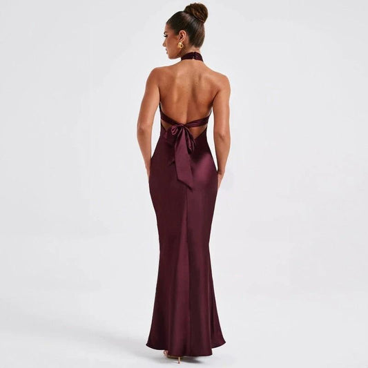 Elegant backless sleeveless summer dress by MANDOTOS, showcasing a flowing fabric and stylish design perfect for warm weather.
