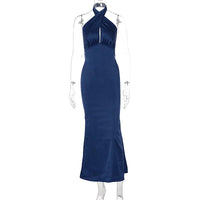 Elegant backless sleeveless summer dress by MANDOTOS, featuring a flowy design ideal for warm weather and stylish occasions.