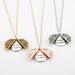 Mandotos sunflower double lettering necklace featuring a gold chain and sunflower pendant with custom engraved initials.