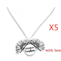 Mandotos sunflower double lettering necklace featuring a sunflower charm and personalized engraved initials on a silver chain.