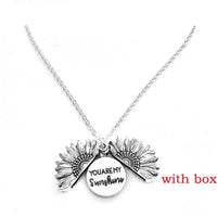 Mandotos sunflower double lettering necklace featuring a gold chain and sunflower pendant, stylish and elegant jewelry piece.