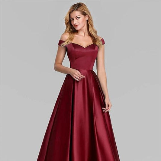 Elegant V-neck solid color long vintage gown dress by MANDOTOS, featuring flowing fabric and a classic silhouette.