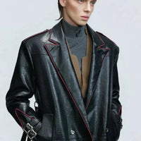 Mandotos wide shoulder fur coat with metal belt and long cut design, featuring a stylish silhouette and cozy fur details.