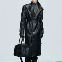 Mandotos wide shoulder long coat with fur collar, metal belt detail, and waist-length cut, stylish and warm outerwear.