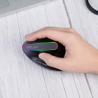 Mandotos wireless mouse with ergonomic design and scroll wheel, black color, on a clean desk surface.