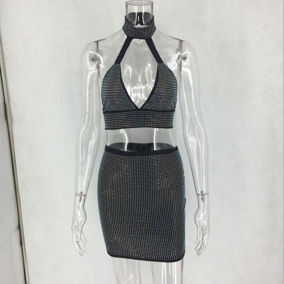 Women’s two-piece dress set with diamond embellishments by MANDOTOS, featuring a stylish top and matching skirt.