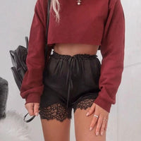 Women's long sleeve crop top T-shirt by MANDOTOS, featuring a fitted design and soft fabric, shown in a stylish casual look.