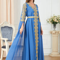 Women's spliced skirt and long sleeve dress by MANDOTOS, featuring a stylish design and flowing fabric.