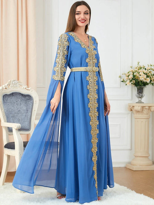 Women's spliced skirt and long sleeve dress by MANDOTOS, featuring a stylish design and flowing fabric.