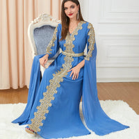 Women's spliced skirt dress with extra long sleeves by MANDOTOS, featuring a stylish and elegant design.