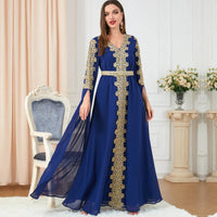 Mandotos women's spliced skirt and extra long sleeve dress showing a stylish design with a fitted waist and flowing fabric.