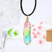 Women's transparent geometric diamond crystal necklace by MANDOTOS featuring sparkling faceted crystal design.